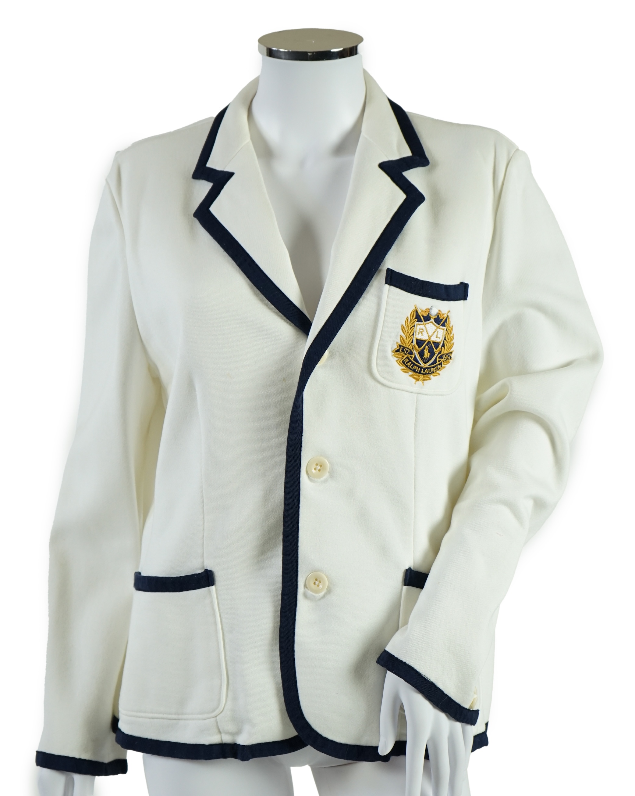 A cream Ralph Lauren blazer with navy blue cord piping. Proceeds to Happy Paws Puppy Rescue